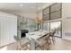 Charming kitchen featuring a large island with seating and stainless steel appliances at 362 Pine Run Dr, Osprey, FL 34229