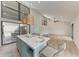 Spacious living room featuring a large kitchen island and oversized windows at 362 Pine Run Dr, Osprey, FL 34229