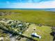 A sprawling property nestled within a picturesque landscape near a serene lake and lush greenery at 4939 Myakka Valley Trl, Sarasota, FL 34241