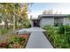 Inviting front entrance with well-maintained landscaping and a charming walkway at 4939 Myakka Valley Trl, Sarasota, FL 34241