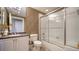 Bathroom featuring a shower-tub combo, tile backsplash, and a marble vanity at 505 S Orange Ave # 501, Sarasota, FL 34236