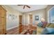 Bright bedroom features wood floors, ceiling fan, comfortable sofa and vibrant area rug at 505 S Orange Ave # 501, Sarasota, FL 34236