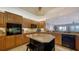 Well-equipped kitchen with stainless appliances, granite counters, island and modern lighting fixtures at 505 S Orange Ave # 501, Sarasota, FL 34236
