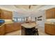 Bright, open kitchen featuring granite countertops, an island, and updated cabinetry at 505 S Orange Ave # 501, Sarasota, FL 34236