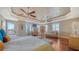 Spacious main bedroom with hardwood floors, tray ceiling, and a private balcony with a view at 505 S Orange Ave # 501, Sarasota, FL 34236
