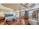 Bright main bedroom featuring hardwood floors, abundant natural light, and a tray ceiling at 505 S Orange Ave # 501, Sarasota, FL 34236
