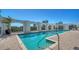 Rooftop pool with city views, framed by white arches on a brick deck under a clear blue sky, perfect for relaxation at 505 S Orange Ave # 501, Sarasota, FL 34236