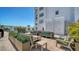 Beautiful rooftop pool deck with comfortable lounge seating and lush landscaping at 505 S Orange Ave # 501, Sarasota, FL 34236