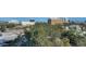 Scenic aerial view of the city showcasing lush trees and nearby buildings on a sunny day at 505 S Orange Ave # 501, Sarasota, FL 34236