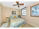 Cozy bedroom with patterned bedding and natural light at 535 Spring Lakes Blvd, Bradenton, FL 34210
