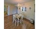 Cozy dining area with a wooden table set, complemented by a view into the kitchen and neutral wall colors at 535 Spring Lakes Blvd, Bradenton, FL 34210