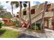 Building exterior featuring a stairway, landscaping, and visible unit number at 535 Spring Lakes Blvd, Bradenton, FL 34210