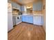Bright kitchen with blue cabinets and white appliances at 535 Spring Lakes Blvd, Bradenton, FL 34210