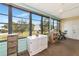 Enclosed lanai with large windows, offering natural light and extra space for relaxation or hobbies at 535 Spring Lakes Blvd, Bradenton, FL 34210