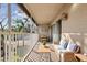 Relaxing balcony with a comfortable sitting area and views of the surrounding neighborhood at 6706 Fairway Gardens Dr # 6706, Bradenton, FL 34203