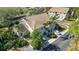 Inviting two-story villa with tile roof, lush landscaping, and a private driveway for convenient parking at 6706 Fairway Gardens Dr # 6706, Bradenton, FL 34203