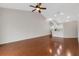Bright and open living area with high ceilings, a ceiling fan, and hardwood flooring at 6706 Fairway Gardens Dr # 6706, Bradenton, FL 34203