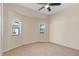 Bright bedroom with neutral carpet, and two windows with views at 7518 Paspalum, Punta Gorda, FL 33955