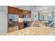 Kitchen with granite countertops, stainless steel appliances, and a breakfast nook at 7518 Paspalum, Punta Gorda, FL 33955