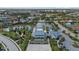Aerial view of community pool, clubhouse, lake and surrounding neighborhood at 12029 Perennial Pl, Lakewood Ranch, FL 34211
