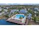 Community clubhouse and pool area with cabanas, dock and a beautiful waterfront view at 12029 Perennial Pl, Lakewood Ranch, FL 34211