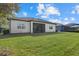 Beautiful backyard view, featuring a screened lanai and well-maintained lawn at 12029 Perennial Pl, Lakewood Ranch, FL 34211
