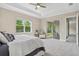 Tranquil bedroom features large windows, soft carpet, and neutral paint at 12029 Perennial Pl, Lakewood Ranch, FL 34211