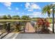 Community lake dock surrounded by lush landscaping, offering a tranquil waterfront view at 12029 Perennial Pl, Lakewood Ranch, FL 34211