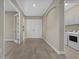 Open foyer leading to a laundry room featuring tile flooring and neutral-colored walls at 12029 Perennial Pl, Lakewood Ranch, FL 34211