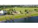 Scenic park featuring a playground, walking paths, lush greenery, and a tranquil pond for relaxation and enjoyment at 12029 Perennial Pl, Lakewood Ranch, FL 34211