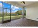 Covered screened patio with brick floors overlooking a spacious backyard at 12029 Perennial Pl, Lakewood Ranch, FL 34211