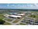 Aerial view of a school campus showcasing the buildings, parking lots, and surrounding residential area at 12029 Perennial Pl, Lakewood Ranch, FL 34211