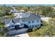 Lovely aerial view of the property, showing a manicured lawn and surrounding trees at 1686 North Dr, Sarasota, FL 34239