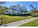 Beautiful two story traditional home with manicured lawn and lovely landscaping at 1686 North Dr, Sarasota, FL 34239