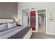 Comfortable bedroom with neutral decor, carpet, and en suite bath at 423 Bahia Beach Blvd, Ruskin, FL 33570