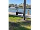 Scenic waterfront views with a bench along the dock, offering a relaxing setting at 4900 38Th S Way # 201, St Petersburg, FL 33711