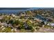 An aerial view of the home, highlighting its location near waterways and surrounded by mature trees at 5500 Bayou Grande Ne Blvd, St Petersburg, FL 33703