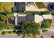 Aerial view of a home with a large pool, spacious backyard, and a well-maintained roof at 5500 Bayou Grande Ne Blvd, St Petersburg, FL 33703