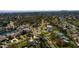 Aerial view showcases the property's location in a neighborhood with waterfront access and lush surroundings at 5500 Bayou Grande Ne Blvd, St Petersburg, FL 33703