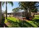 The screened-in pool is nestled within a well-maintained backyard, offering a private retreat at 5500 Bayou Grande Ne Blvd, St Petersburg, FL 33703