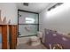 Bathroom featuring a black-framed shower, tile accents, and new toilet, ready for finishing touches at 5500 Bayou Grande Ne Blvd, St Petersburg, FL 33703