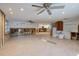 Spacious living room with tile floors, exposed framing, and recessed lighting, ready for renovation at 5500 Bayou Grande Ne Blvd, St Petersburg, FL 33703