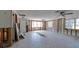 Bright living room featuring tile flooring, ample natural light, and exposed framing, awaiting remodel at 5500 Bayou Grande Ne Blvd, St Petersburg, FL 33703