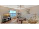 Inviting bonus room with water views, wood floors, and a cozy seating area at 6920 74Th Street E Cir, Bradenton, FL 34203