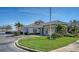Well-maintained clubhouse exterior with lush landscaping, ample parking, and easy access at 6920 74Th Street E Cir, Bradenton, FL 34203