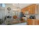 Spacious kitchen with granite counters and stainless appliances offers a functional workspace and adjacent dining area at 6920 74Th Street E Cir, Bradenton, FL 34203