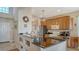 Modern kitchen features granite countertops, stainless steel appliances, and ample cabinet space at 6920 74Th Street E Cir, Bradenton, FL 34203