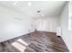 Bright bedroom featuring modern flooring and ample closet space for convenient storage at 712 N Elm St, Englewood, FL 34223