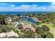 Stunning aerial view showcases a beautiful home with a pool overlooking scenic waterways and lush surroundings at 7820 Seville Cir, Bradenton, FL 34209