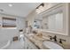 Beautiful bathroom features a double vanity with granite countertop and stylish fixtures at 7820 Seville Cir, Bradenton, FL 34209